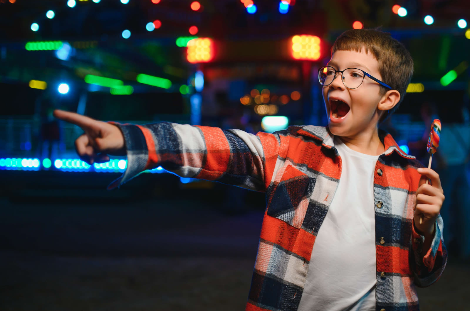 Child playing arcade games in the Gamezone Arcade